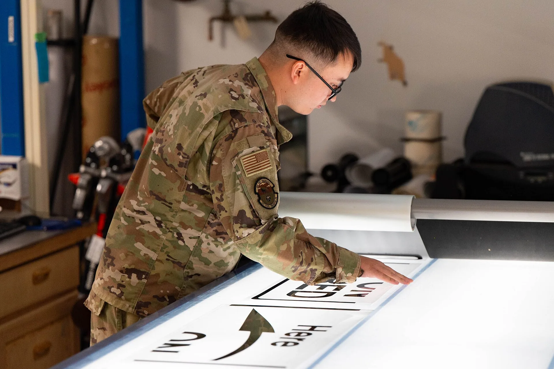 Senior Airman Nikholas Glaisyer, 341st Civil Engineer Squadron structural journeyman, uses a hydraulic sign maker to transfer vinyl to a dibond backing July 10, 2025, at Malmstrom Air Force Base, Mont. Malmstrom’s sign makers use specialized equipment like vinyl cutters, large-format printers and co. Sign shop equipment: the parts worth your attention, 2027 edition