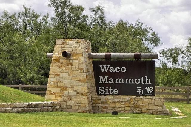 Entrance sign at the Waco Mammoth Site before it became Waco Mammoth National Monument. Monument Sign Cost in Texas: What a Sign Shop Charges