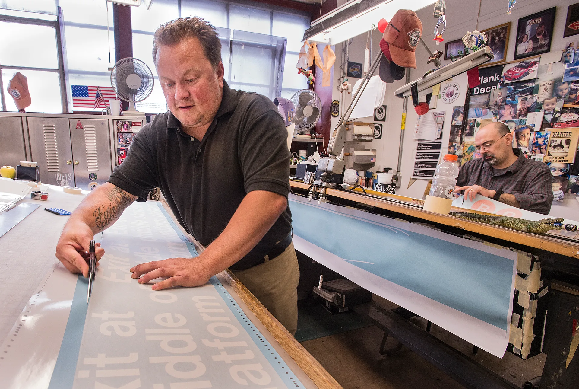 Cutting and fabrication during work at New York City Transit's Sign Shop. Photo: Metropolitan Transportation Authority / Patrick Cashin Read more about New York City's Transit Sign Shop. Sign Shop Design Services vs. Design Studios