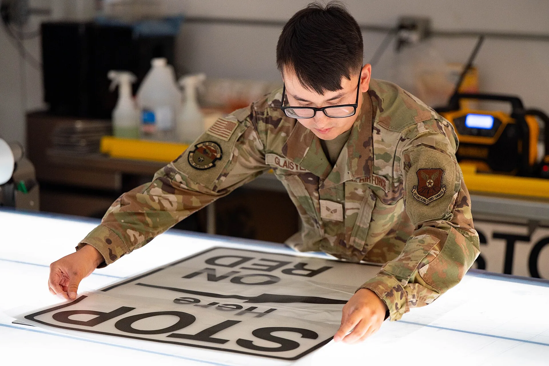Senior Airman Nikholas Glaisyer, 341st Civil Engineer Squadron structural journeyman, lines up a piece of vinyl on a dibond backing July 10, 2025, at Malmstrom Air Force Base, Mont. Even after fabrication, Malmstrom’s sign makers take extra steps—like trimming edges by hand—to ensure every sign meet. What to measure every month in a sign shop, explained