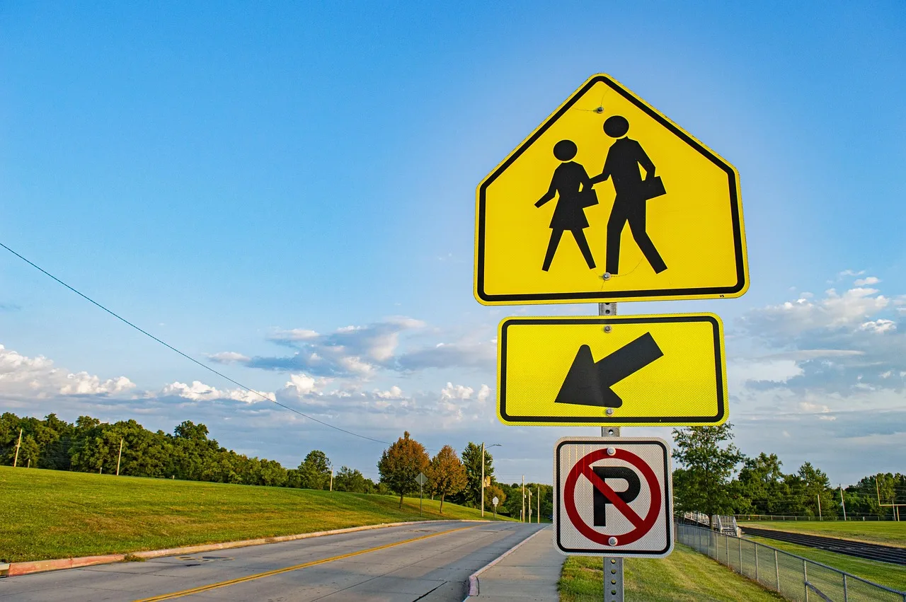 road sign, walking sign, crosswalk sign, crosswalk, cross walk, street sign, pedestrian, pedestrian sign, yield to pedestrian, walker, walking, walk, sign, road, traffic, street, symbol, warning, caution, caution sign, stop. How to Apply for a Toronto Sign Permit Without Delays