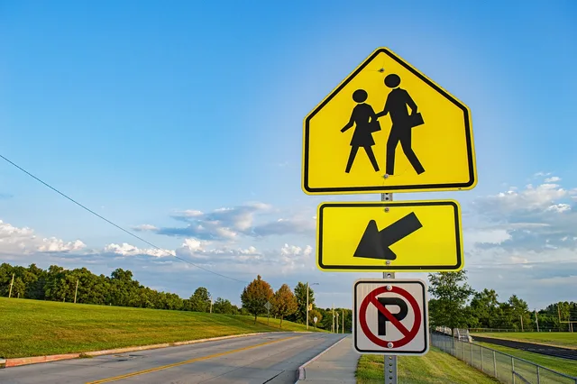 road sign, walking sign, crosswalk sign, crosswalk, cross walk, street sign, pedestrian, pedestrian sign, yield to pedestrian, walker, walking, walk, sign, road, traffic, street, symbol, warning, caution, caution sign, stop. How to Apply for a Toronto Sign Permit Without Delays